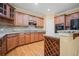 Updated kitchen features granite countertops, stainless steel appliances, and hardwood floors at 403 Glenhurst Trce, Canton, GA 30115