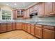 Charming kitchen with granite countertops, stainless steel appliances, and hardwood floors at 403 Glenhurst Trce, Canton, GA 30115