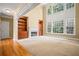 Spacious living room boasts a fireplace, built-in shelving, and large windows for natural light at 403 Glenhurst Trce, Canton, GA 30115