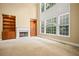 Bright living room with fireplace and shelving offers ample natural light at 403 Glenhurst Trce, Canton, GA 30115