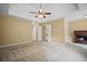 Open main bedroom with fireplace, shelving, and abundant natural light from multiple windows at 403 Glenhurst Trce, Canton, GA 30115