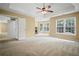 Expansive main bedroom featuring a fireplace, tray ceiling, large windows, and a sitting area at 403 Glenhurst Trce, Canton, GA 30115