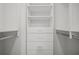 Large walk-in closet with custom shelving and drawer units at 403 Glenhurst Trce, Canton, GA 30115