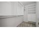 Organized walk-in closet with shelving and hanging space at 403 Glenhurst Trce, Canton, GA 30115