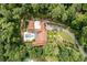 Aerial view of estate with pool, manicured gardens and stone home at 4975 Rebel Trl, Atlanta, GA 30327