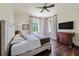 Comfortable bedroom featuring hardwood floors, a dresser, a bed, and windows offering natural light at 4975 Rebel Trl, Atlanta, GA 30327