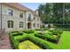 Stone home featuring a beautifully landscaped front yard and fountain at 4975 Rebel Trl, Atlanta, GA 30327