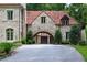 Stone garage exterior with drive, offering a glimpse of classic architecture at 4975 Rebel Trl, Atlanta, GA 30327