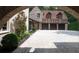 Garage interior with cobblestone floor and brick archway leading to the main house at 4975 Rebel Trl, Atlanta, GA 30327