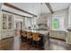 Spacious kitchen features a large island with seating, custom cabinets, and modern lighting at 4975 Rebel Trl, Atlanta, GA 30327