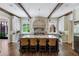 Well-appointed kitchen featuring a large center island, custom cabinetry, and stone backsplash at 4975 Rebel Trl, Atlanta, GA 30327