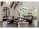 Open-concept living area flowing into the kitchen, featuring hardwood floors and abundant natural light at 4975 Rebel Trl, Atlanta, GA 30327