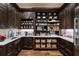 Spacious walk-in pantry with dark wood cabinets, marble countertops, and open shelving at 4975 Rebel Trl, Atlanta, GA 30327