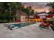 Stunning twilight view of a pool with in-pool loungers and lounge chairs at a luxury property at 4975 Rebel Trl, Atlanta, GA 30327