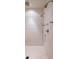 Modern walk-in shower featuring multiple shower heads, white tile, and sleek fixtures at 4975 Rebel Trl, Atlanta, GA 30327