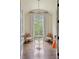Elegant sitting room with hardwood floors, a crystal chandelier, and large windows at 4975 Rebel Trl, Atlanta, GA 30327