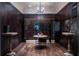 Stunning wine cellar with custom racks, dark wood accents, and elegant tasting area at 4975 Rebel Trl, Atlanta, GA 30327