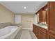 Spacious bathroom with a soaking tub, double sink vanity, and a separate door to toilet at 775 Mountain View Nw Ter, Marietta, GA 30064