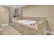 Bathroom with tiled tub and glass shower at 775 Mountain View Nw Ter, Marietta, GA 30064