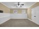 Large bonus room with neutral carpeting, wainscoting, and natural light at 775 Mountain View Nw Ter, Marietta, GA 30064