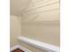 Walk in closet with white shelves and neutral paint at 775 Mountain View Nw Ter, Marietta, GA 30064