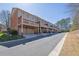 Townhome with a large backyard deck, garage, and well-maintained front yard at 775 Mountain View Nw Ter, Marietta, GA 30064