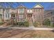 Charming brick townhome with manicured landscaping and inviting entryway stairs at 775 Mountain View Nw Ter, Marietta, GA 30064