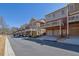 Street view of multi-story townhomes with drive-under garages and deck balconies at 775 Mountain View Nw Ter, Marietta, GA 30064