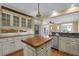 Bright kitchen features white cabinets, a butcher block island, stainless steel appliances, and exposed brick backsplash at 775 Mountain View Nw Ter, Marietta, GA 30064