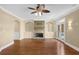 Inviting living room with built-in bookshelves, stone fireplace, and hardwood flooring at 775 Mountain View Nw Ter, Marietta, GA 30064