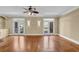 Spacious living room with hardwood floors, double doors, and modern ceiling fan at 775 Mountain View Nw Ter, Marietta, GA 30064