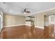 Open-concept living area features hardwood floors, ceiling fan, and arched entryway at 775 Mountain View Nw Ter, Marietta, GA 30064