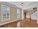 Bright living room with hardwood floors, large windows, and traditional staircase at 775 Mountain View Nw Ter, Marietta, GA 30064