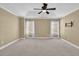 The main bedroom has carpet, white trim, ceiling fan, and natural light at 775 Mountain View Nw Ter, Marietta, GA 30064