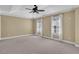 Spacious main bedroom with carpet, ceiling fan, white trim, and natural light at 775 Mountain View Nw Ter, Marietta, GA 30064