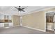 A carpeted main bedroom features a desk, cabinets, and an en suite bathroom at 775 Mountain View Nw Ter, Marietta, GA 30064