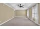 Large main bedroom with trey ceiling, carpet, neutral paint, ceiling fan, and natural light at 775 Mountain View Nw Ter, Marietta, GA 30064