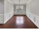 Dining room with dark hardwood floors and decorative trim at 12981 Dartmore Cir, Alpharetta, GA 30005