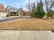 Street view of the front yard with trees and a view of other homes at 12981 Dartmore Cir, Alpharetta, GA 30005