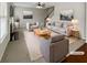 Bright living room features a fireplace, staircase, and neutral decor at 12981 Dartmore Cir, Alpharetta, GA 30005