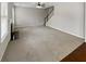 An empty living room features neutral walls, a fireplace, and stairs at 12981 Dartmore Cir, Alpharetta, GA 30005