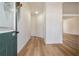 Bright foyer with wood-look floors leading to the living areas; features a staircase and natural light at 2225 Saint Thomas Way, Suwanee, GA 30024