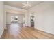 Spacious living room with modern lighting and views of the kitchen and dining areas at 2225 Saint Thomas Way, Suwanee, GA 30024