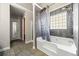 Main bathroom features a soaking tub, glass block window, and marble tile at 4046 Arnolds Mill Opas, Douglasville, GA 30135