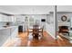 Charming dining room with hardwood floors, a modern light fixture, and a round wooden table at 4046 Arnolds Mill Opas, Douglasville, GA 30135