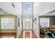 Inviting foyer with hardwood floors, high ceilings, large window, and a white front door at 4046 Arnolds Mill Opas, Douglasville, GA 30135
