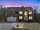 Stunning two-story brick home with a well-manicured lawn at 4046 Arnolds Mill Opas, Douglasville, GA 30135