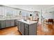 Kitchen island with white countertop surrounded by gray cabinets and stainless steel appliances at 4046 Arnolds Mill Opas, Douglasville, GA 30135