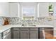 Updated kitchen showcases stainless steel appliances, granite countertops, and a stylish backsplash at 4046 Arnolds Mill Opas, Douglasville, GA 30135