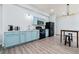 Modern kitchen with blue cabinets, stainless steel appliances, and breakfast bar at 4046 Arnolds Mill Opas, Douglasville, GA 30135
